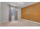 Bedroom features neutral walls, carpet and accent wall offering a peaceful and inviting atmosphere at 21900 E 46Th Pl, Aurora, CO 80019
