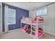 bedroom with a fun bunk bed and plenty of space for activities and play at 21900 E 46Th Pl, Aurora, CO 80019