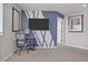 Multi-use bonus room featuring a modern accent wall and neutral carpet, ideal for entertaining or a home office at 21900 E 46Th Pl, Aurora, CO 80019