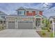 Inviting two-story home with stone accents, three-car garage, and well-maintained landscaping at 21900 E 46Th Pl, Aurora, CO 80019