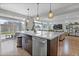Open concept kitchen with island, stainless steel appliances, and lots of natural light streaming in through the sliding doors at 21900 E 46Th Pl, Aurora, CO 80019