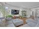 Bright living room featuring hardwood floors, comfortable seating, and plenty of natural light at 21900 E 46Th Pl, Aurora, CO 80019
