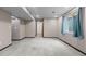 The finished basement has neutral walls and carpeting at 7767 Elmwood St, Littleton, CO 80125