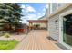 The deck features a pergola, outdoor shed, and backs to a fenced yard at 7767 Elmwood St, Littleton, CO 80125
