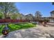Spacious backyard with well-maintained lawn, patio, trampoline, and seating area at 10647 Nucla St, Commerce City, CO 80022