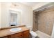 Bathroom with laminate countertop, shower, toilet, and decorative mirror at 10647 Nucla St, Commerce City, CO 80022