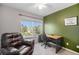 Comfortable office space with a large window, leather chair and wooden desk for work at 10647 Nucla St, Commerce City, CO 80022