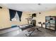 Home gym featuring modern exercise equipment and wall-mounted speakers for an immersive workout experience at 10647 Nucla St, Commerce City, CO 80022