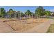 A community playground featuring swings, a climbing net, and benches at 10647 Nucla St, Commerce City, CO 80022