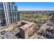 City high rise view showing the surrounding greenery and golf course on a bright, sunny day at 99 S Downing St # 605, Denver, CO 80209