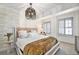 Comfortable bedroom with a modern chandelier, large bed, and shuttered windows at 99 S Downing St # 605, Denver, CO 80209