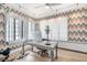 Bright home office with hardwood floors, and large windows with shutter coverings at 99 S Downing St # 605, Denver, CO 80209