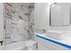 Modern bathroom featuring beautiful tile in the shower, a toilet and a vessel sink at 1100 Urban St, Lakewood, CO 80401