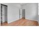 Bedroom with hardwood floors and closet at 1100 Urban St, Lakewood, CO 80401