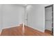 This bedroom features hardwood floors, light gray walls, and a closet at 1100 Urban St, Lakewood, CO 80401