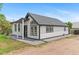Modern home with clean white siding, contrasting trim and a well-kept front yard at 1100 Urban St, Lakewood, CO 80401