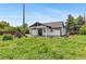 Charming house exterior with fresh paint, a porch, and dark trim at 1100 Urban St, Lakewood, CO 80401