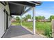 Covered patio with a view of the yard and landscaping at 1100 Urban St, Lakewood, CO 80401