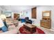 Spacious basement with comfortable seating area, pool table, and natural light at 2807 S Nelson St, Lakewood, CO 80227