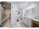 Modern bathroom with a tiled walk-in shower and dual sink vanity with lots of storage at 2807 S Nelson St, Lakewood, CO 80227