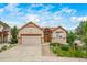 Charming single-Gathering home featuring a two-car garage, manicured landscaping and a lovely stone accent at 2807 S Nelson St, Lakewood, CO 80227