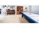 Recreational room features a bar, shelving, and air hockey table perfect for entertainment at 2807 S Nelson St, Lakewood, CO 80227
