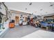 Organized garage with storage solutions, work space, and a motorcycle at 2807 S Nelson St, Lakewood, CO 80227