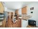 Well-equipped kitchen featuring granite countertops, stainless steel appliances, and a central island, perfect for culinary enthusiasts at 2807 S Nelson St, Lakewood, CO 80227