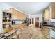 Spacious kitchen with light wood cabinetry, granite countertops, stainless appliances, and ample storage and counter space at 2807 S Nelson St, Lakewood, CO 80227