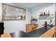 Basement bar area with a large mirror, sink, cabinets, and liquor display at 2807 S Nelson St, Lakewood, CO 80227