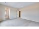Spacious carpeted bedroom with access to ensuite and walk-in closet provides ample space at 24851 E 33Rd Dr, Aurora, CO 80019