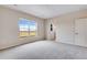 Spacious carpeted bedroom with a large window offering scenic views and plenty of natural light at 24851 E 33Rd Dr, Aurora, CO 80019