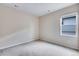 Bright carpeted bedroom features a neutral palette, window, and recessed lighting at 24851 E 33Rd Dr, Aurora, CO 80019