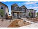 Charming two-story home with a stone foundation and a well-manicured front yard at 24851 E 33Rd Dr, Aurora, CO 80019