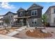Beautiful two-story home with a stone foundation and a well-manicured front yard at 24851 E 33Rd Dr, Aurora, CO 80019