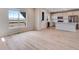 Bright kitchen with an island bar flows into the dining and living areas at 24851 E 33Rd Dr, Aurora, CO 80019
