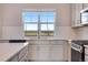 Bright kitchen with quartz countertops, stainless steel appliances and a scenic view at 24851 E 33Rd Dr, Aurora, CO 80019