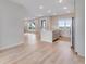 Modern kitchen with white cabinets and a center island offers lots of counter space at 24851 E 33Rd Dr, Aurora, CO 80019