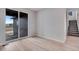 Open floor plan living room with sliding door and stair access at 24851 E 33Rd Dr, Aurora, CO 80019