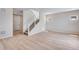 Open floor plan living room with stairs to upper floor at 24851 E 33Rd Dr, Aurora, CO 80019