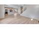 The open concept main floor features modern white color scheme at 24851 E 33Rd Dr, Aurora, CO 80019