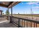 Relax on this inviting porch overlooking the landscaped front yard and a scenic view at 24851 E 33Rd Dr, Aurora, CO 80019