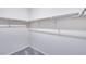 Bright walk-in closet with organized shelving provides ample storage space at 24851 E 33Rd Dr, Aurora, CO 80019