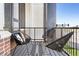 Outdoor balcony area featuring three modern chairs and a patterned rug at 8240 E 36Th Ave # 33, Denver, CO 80238