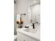 Modern bathroom featuring white vanity and black fixtures at 8240 E 36Th Ave # 33, Denver, CO 80238