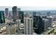 Wide aerial view of a city skyline, showcasing the dense arrangement of buildings and infrastructure at 1891 Curtis St # 1613, Denver, CO 80202
