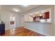 Dining area with hardwood floors opening up into the kitchen and bathroom at 1891 Curtis St # 1613, Denver, CO 80202