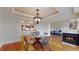 Charming dining room with modern lighting, hardwood floors, and an open-concept design at 1891 Curtis St # 1613, Denver, CO 80202
