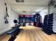 A well-equipped gym featuring an array of exercise machines and free weights on a wooden floor at 1891 Curtis St # 1613, Denver, CO 80202