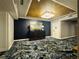 Hallway featuring a dresser, mirror, and overhead lighting, complemented by decorative carpeting at 1891 Curtis St # 1613, Denver, CO 80202
